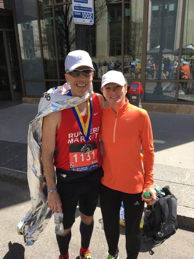Man and woman after completing a marathon